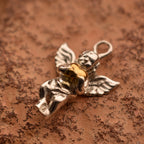 Pandantiv „Iubirea Îngerului” din argint 925 – talisman handmade pentru protecție și tandrețe, bijuterie sculpturală în stil boho și rustic | Art Diva